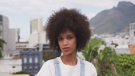 front view of mixed race woman on rooftop