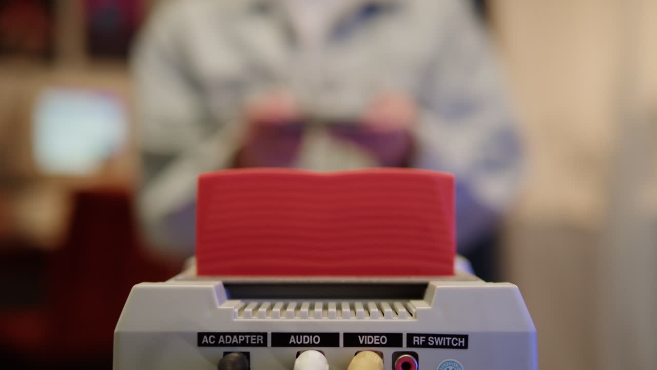 Retro Video Game Console with Person