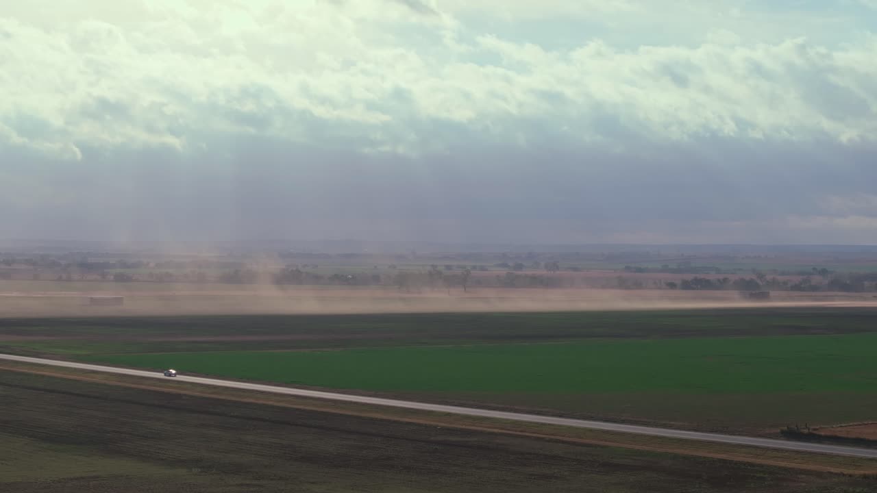 Dust storm over an open highway in Oklahoma, USA, conveying solitude