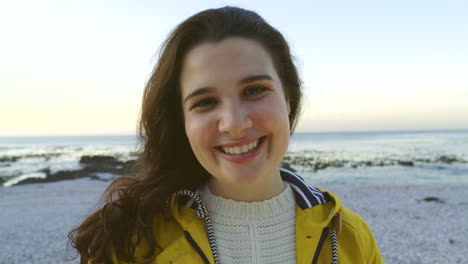 Portrait-of-a-happy-young-woman-at-the-beach