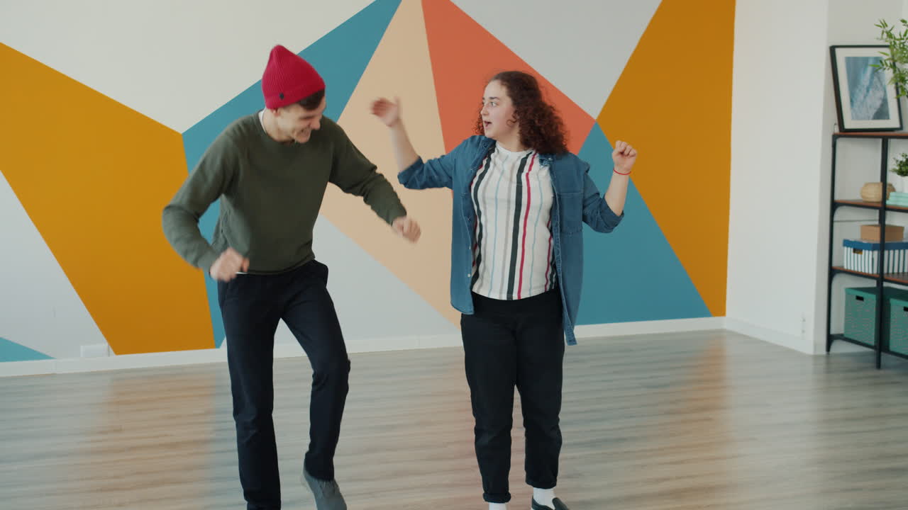 Two Young Adults Dancing