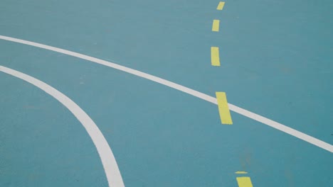 pan over lines on ground on an outdoor sport court