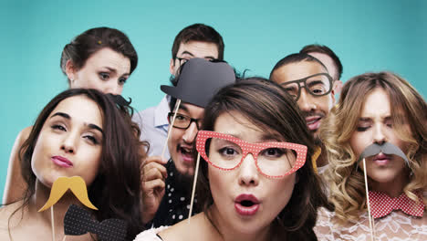 multi racial group of funny people celebrating slow motion party photo booth