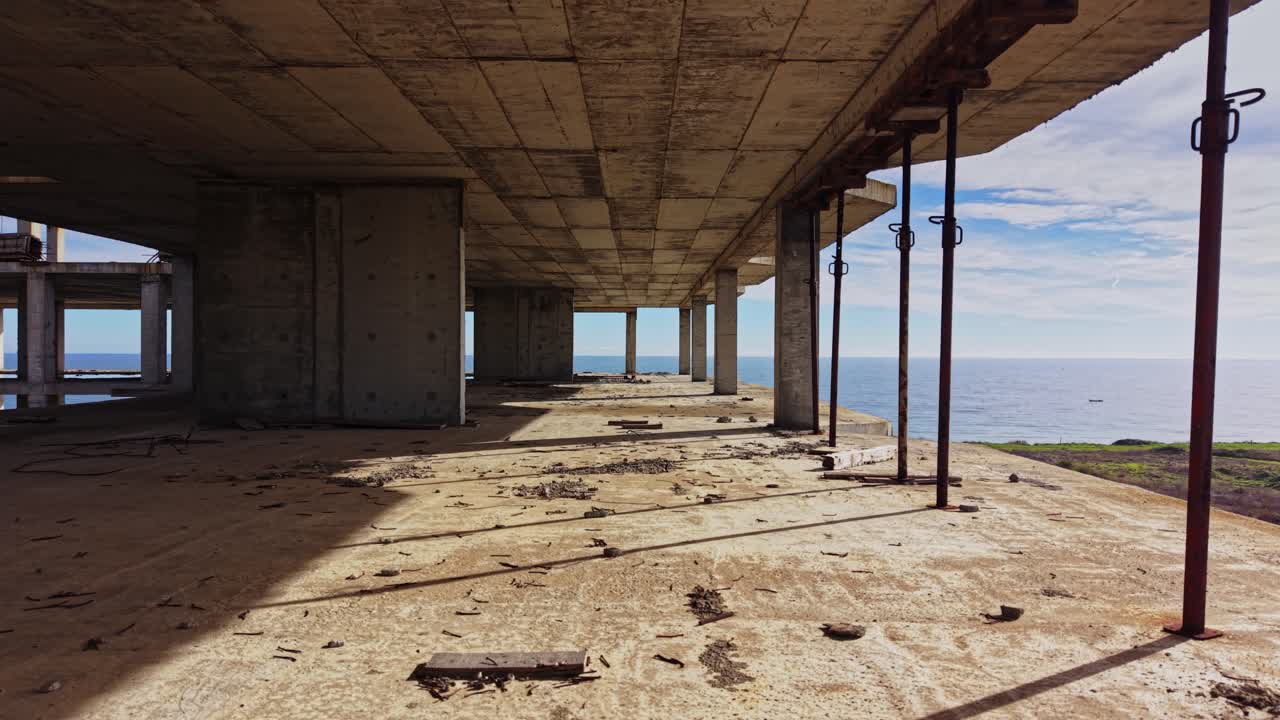 Abandoned coastal structure reveals serene ocean view from above