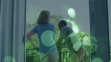 animation of light spots over senior diverse couple