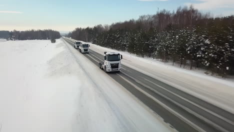 trucks on snowy highway