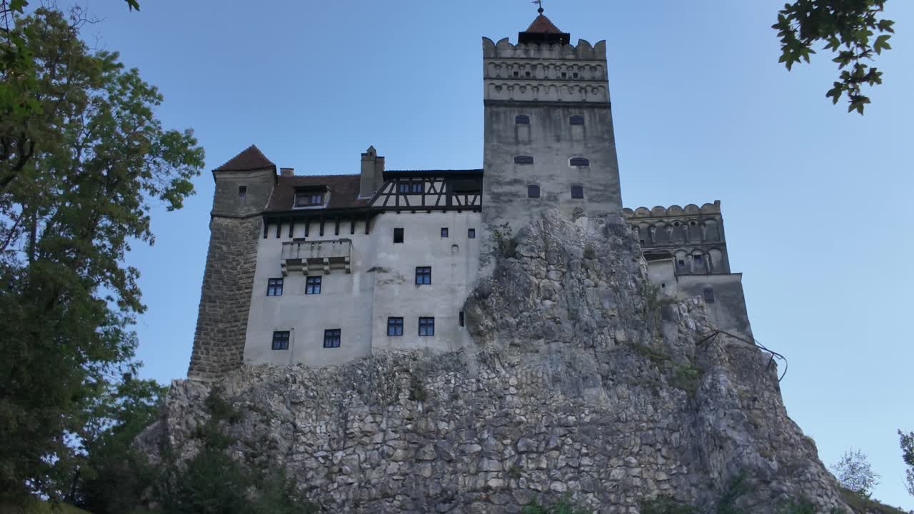 Bran Castle in Romania, showcasing its dramatic stone walls and hilltop position