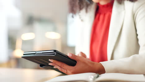 A-female-lawyer-typing-an-email-on-a-tablet-inside