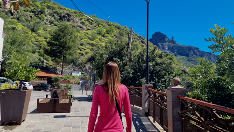 close-up shot of girl walking down the street of small spanish town