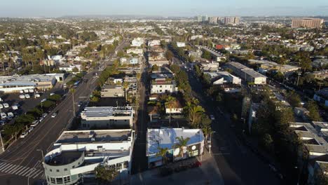 aerial view overlooking the cityscape of venice, golden hour in los angeles, usa - tilt, drone shot