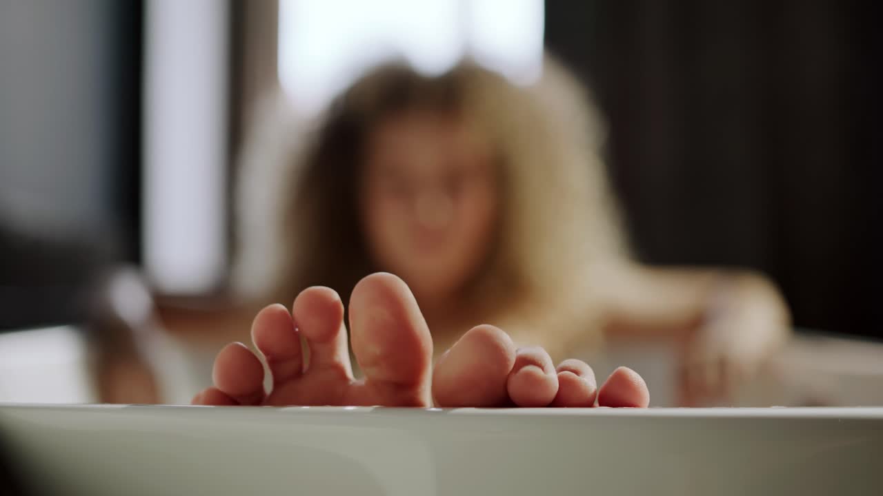 Happy Woman Relaxing And Enjoying Life While Taking A Shower In A Tub,  Bokeh Close Up Of Toes Free Stock Video Footage Download Clips People