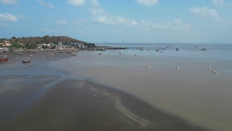 sea after low tide boat standing alibuag drone shoot
