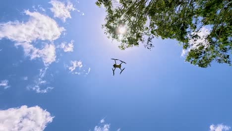 drone flying upward through clear blue sky