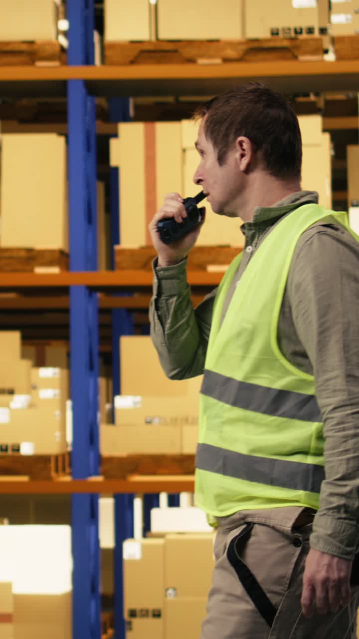 Vertical Video Instructions Over Walkie-Talkie, Industrial Worker, For Colleague To Move Cargo