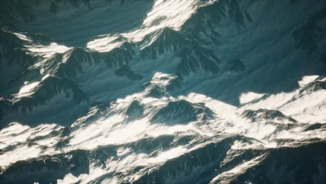 aerial view of the alps mountains in snow