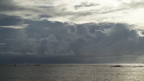 Peaceful-ocean-waves-with-breathtaking-clouds-in-background-during-a-sunny-day