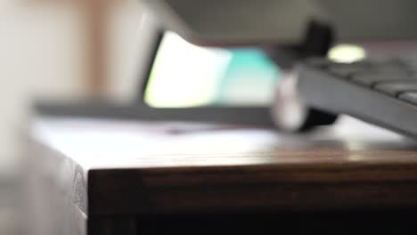 hand placing asthma inhaler on desk