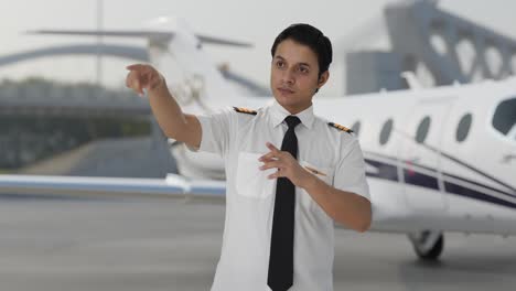 indian pilot giving instructions on airport