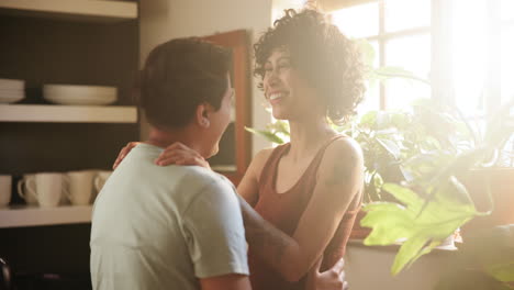 happy lesbian couple in a kitchen