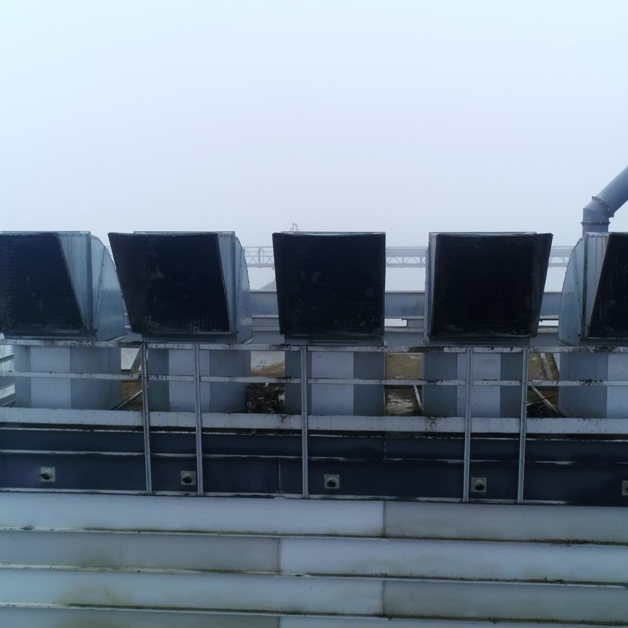 Aerial view of big metal storage construction. Steel huge wheat grain elevator