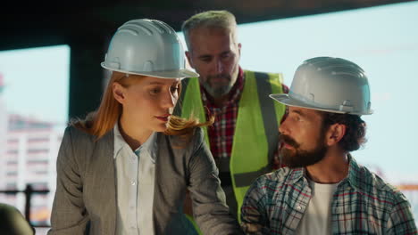 construction team discussing project plans on site