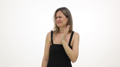 woman reacting with disgust to a bad smell