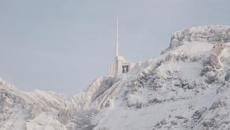 Swiss-Mountain-Saentis-in-the-alps-with-fresh-snow-and-fog