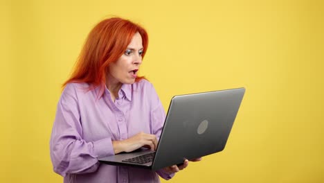 surprised woman looking at laptop