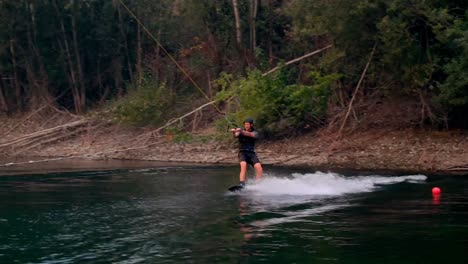 man wakeboarding in the river 4k