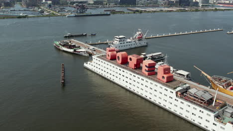 Aerial-View-Of-Botel-Hotel-At-The-Ferry-Terminal-Of-NDSM-Wharf-In-Amsterdam,-The-Netherlands