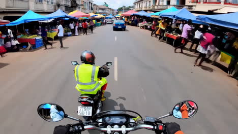 motorcycle ride through a busy african market