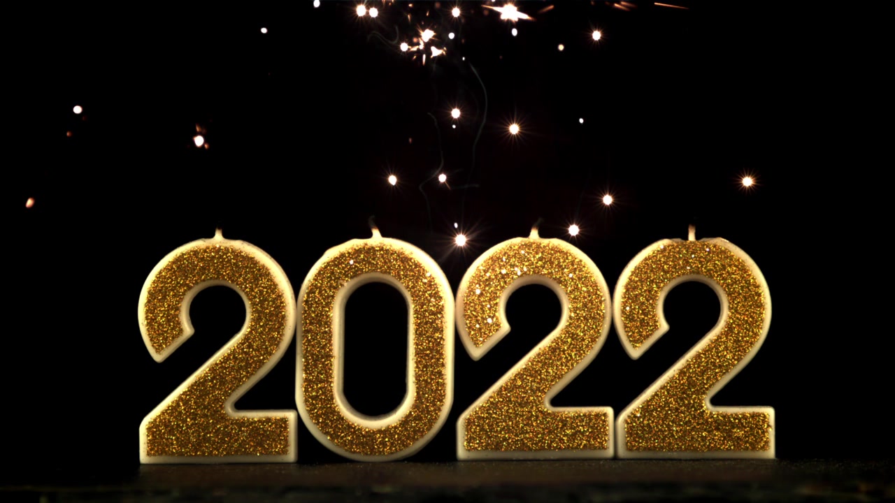 Candele dorate festive del 2022 con stelline scintillanti per la celebrazione di Capodanno