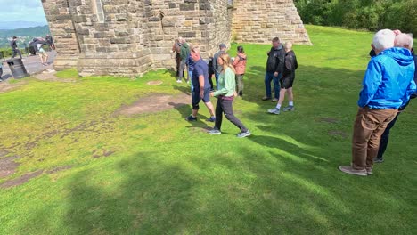 tourists explore historic monument in stirling, scotland