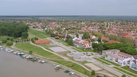 aerial tracking shot circling a resort on the danube river in novi sad, serbia