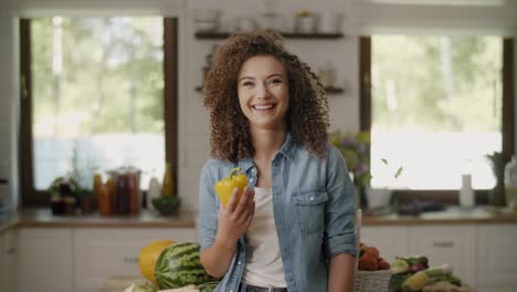 Beautiful-woman-holding-pepper-in-the-kitchen/Rzeszow/Poland