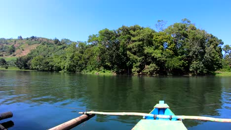 on board in a bamboo raft at the center of the lake