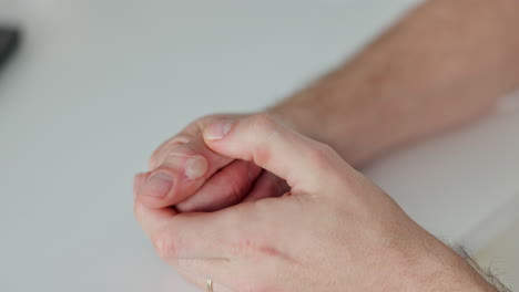 close-up of clasped hands