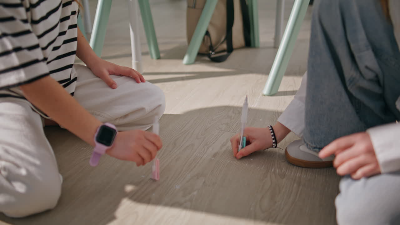 Closeup classmates hands playing at school floor. Unrecognizable girls at break