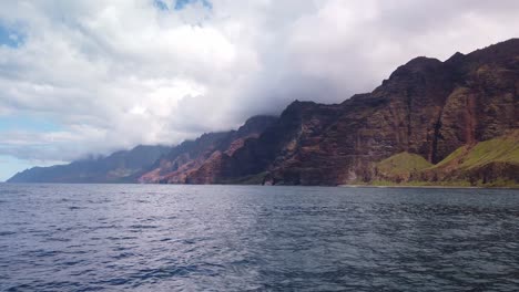 gimbal wide panning shot from a boat of the rugged southern na pali coast in kaua'i, hawai'i