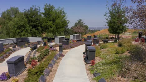 low pov shot along the path of a serene nature garden at a mortuary in california