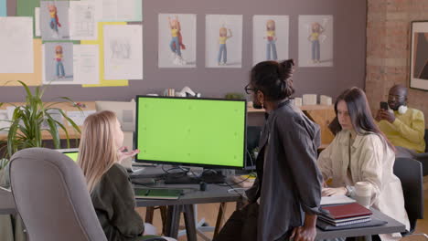 multiethnic team of graphic designers working together in an animation studio 7