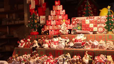 christmas shopping at a festive christmas market in strasbourg, france europe