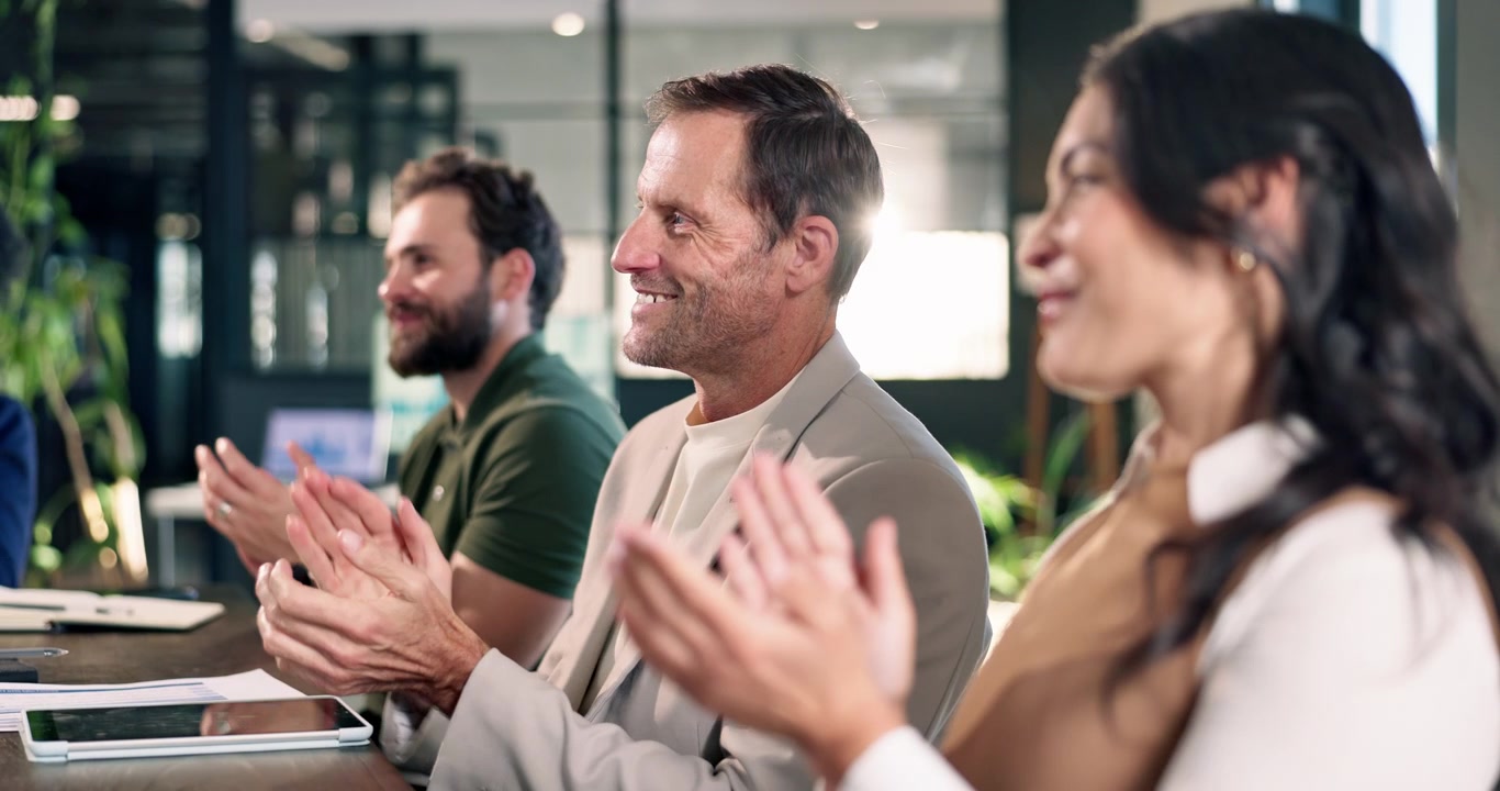 Diverse Business Team Applauding During Office Meeting