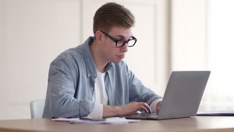 young man working on laptop