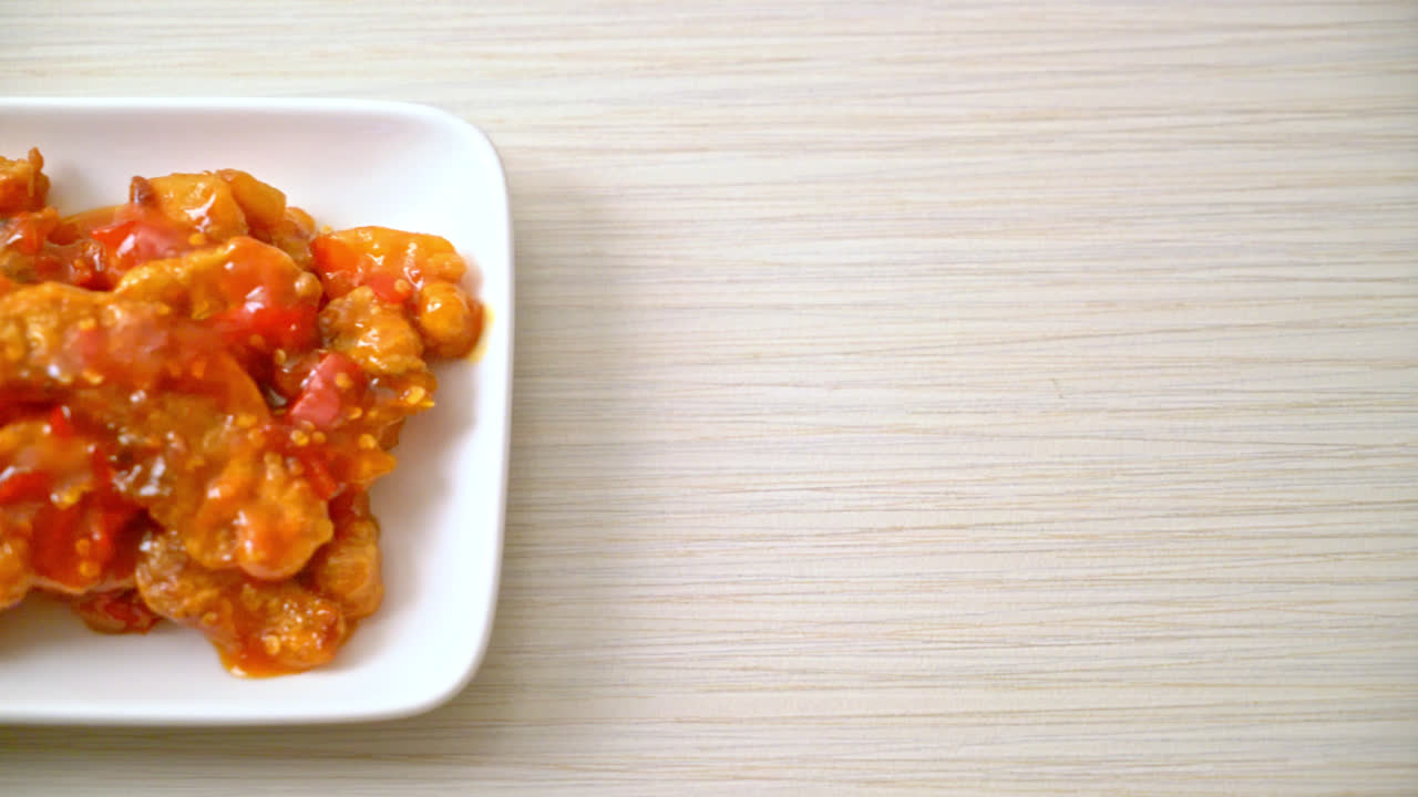 Fried fish topped with three flavors (sweet, sour, spicy) chili sauce