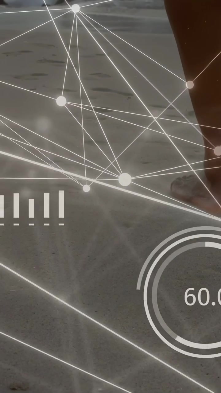 Vertical video: Man walking barefoot on shore each step updating AR gauges nodes and data for tech