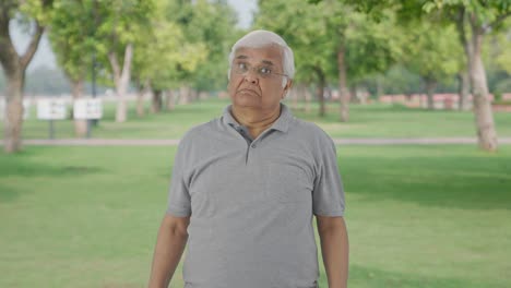 Confused-Indian-old-man-asking-what-question-in-park