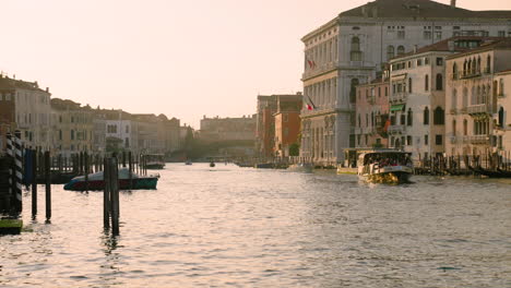 panning through grand canal with sailing ferry boat in venice, italy