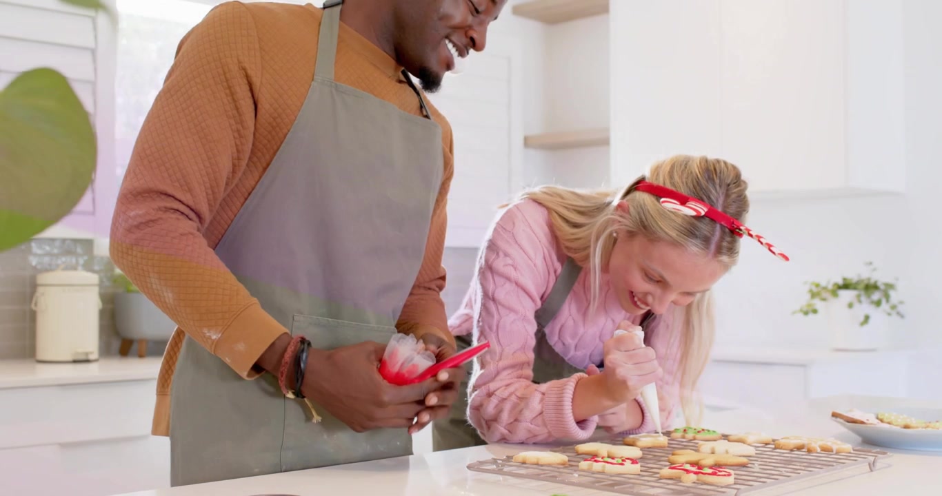 Couple decorating cookies using icing bags overlay showing loading progress tracking baking in tech