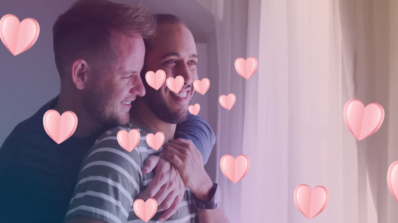 다양한 동성애 커플이 포옹하는 다양한 동성애 커플의 심장 아이콘의 애니메이션